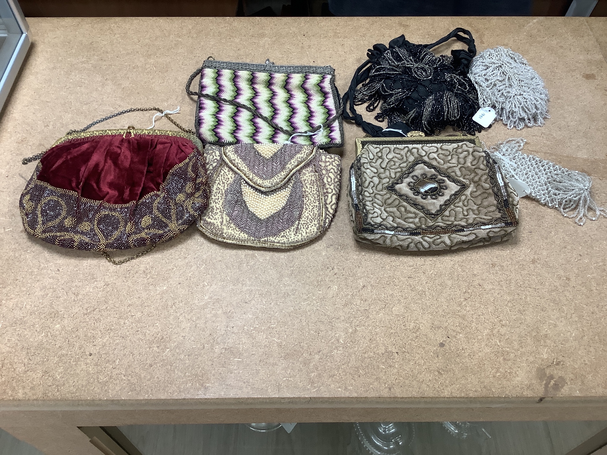 A collection of approximately fifty Victorian and later beadwork, white metal and fabric purses etc.